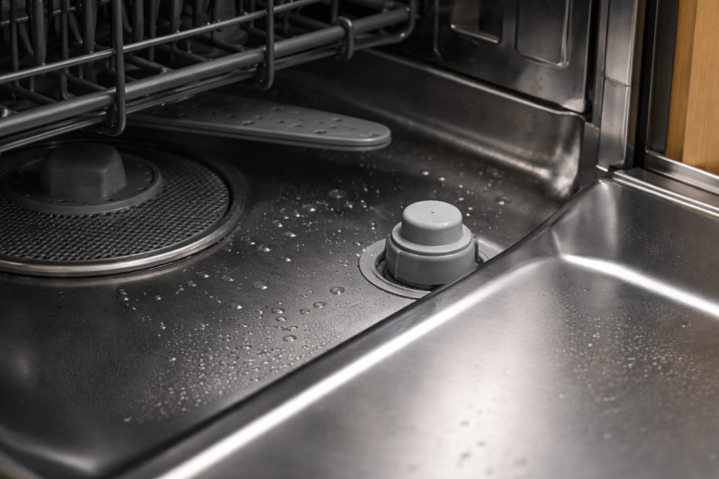 Dishwasher float assembly inside the dishwasher tub showing the float that activates the float switch.